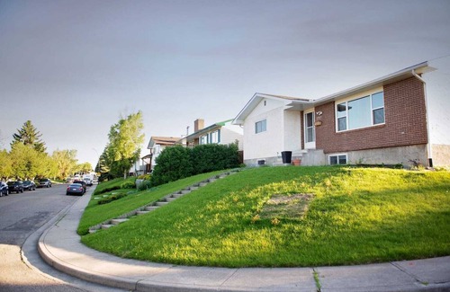 Calgary House | Simply beautiful and comfortable main suite with a view.