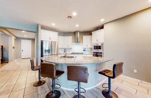 Canyon Trails West House | Single-story home with enclosed yard, private pool, hot tub, patio, & grill
