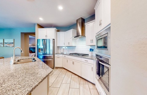 Canyon Trails West House | Single-story home with enclosed yard, private pool, hot tub, patio, & grill