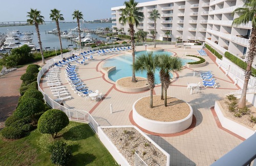 Orange Beach Condo | Sit back and watch the boats pass through on the intercoastal!