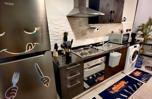 Manama Condo | Sky-Midway Oasis, H Family Home