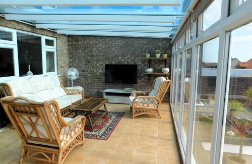 Sheringham Apartment | Sky View - Enjoy panoramic roof top views from the sunny conservatory or outside deck.