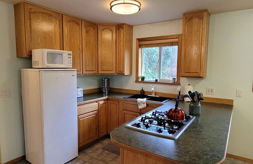 Glacier Apartment | Skyline cottage, private hot tub, wifi sleeps 4!