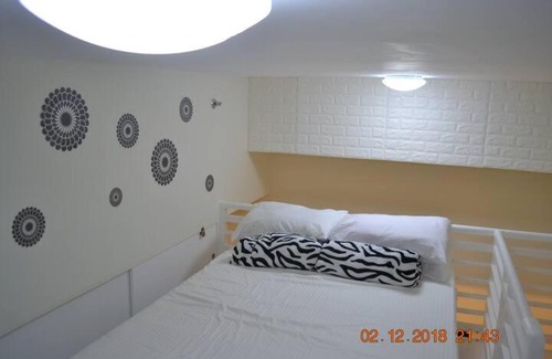 Tagaytay Apartment | SMDC Wind Residences 102 Loft Bedroom Facing Amenities with WIFI and Parking