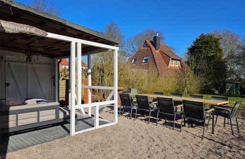 Altfunnixsiel Apartment | Smittshörn 3 - Nordsee Erdgeschosswohnung mit eingezäunten Garten, Kamin und Lounge!