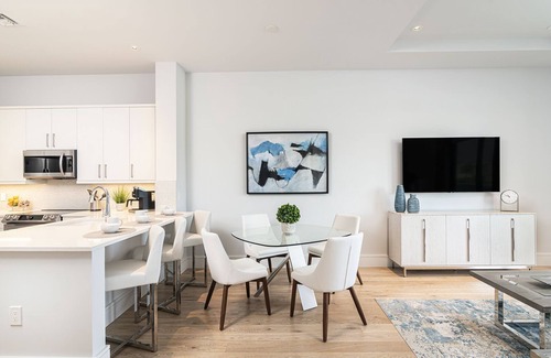 Old Naples Condo | SOCE FLATS 202 - Luxury Two Bedroom with Wraparound Balcony!
