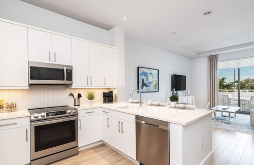 Old Naples Condo | SOCE FLATS 202 - Luxury Two Bedroom with Wraparound Balcony!