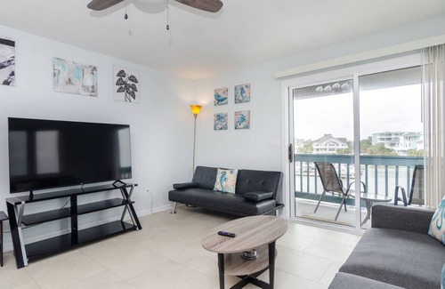 North Carolina Coast Condo | Sound front condo w dock access and rooftop deck!