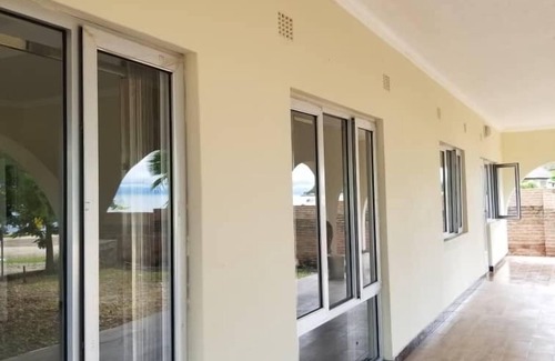 Southern Region House | Spacious 4-bedroom beach house with WiFi, AC in beautiful Monkey Bay