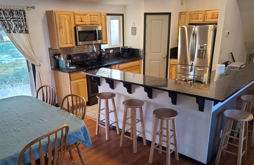 Veradale House | Spacious 5-bedroom residential home with fire pit