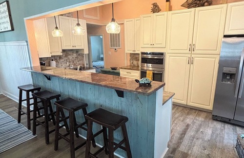 Henrico House | Spacious 7-bedroom, 5-bath home on 168' of a wide, deep-water cove.