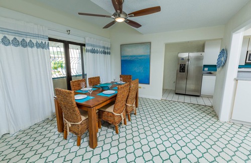 Orange Grove Condo | Spacious beach front living with spectacular Caribbean sea-views.