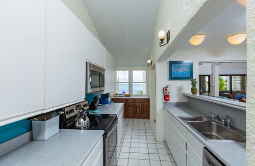Orange Grove Condo | Spacious beach front living with spectacular Caribbean sea-views.