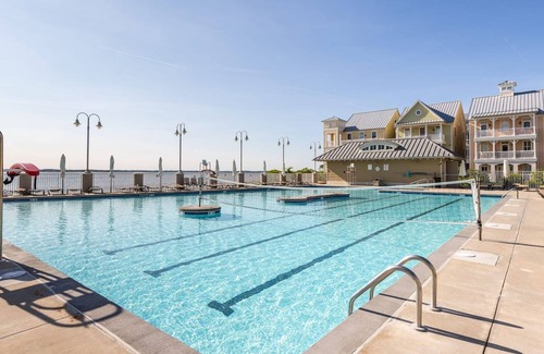 Sunset Island House | Spacious beachside home with fireplace, washer/dryer, pools, dock, & gym