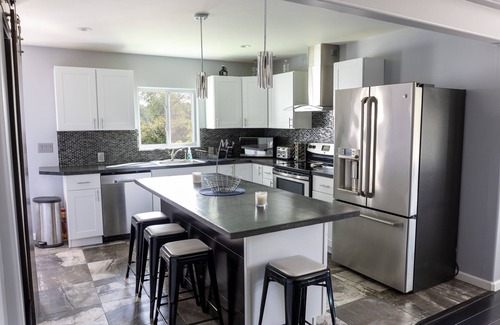 Alden House | Spacious home near Torch Lake w/custom back patio, steps away from public access