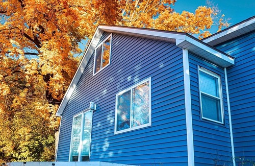 Alden House | Spacious home near Torch Lake w/custom back patio, steps away from public access