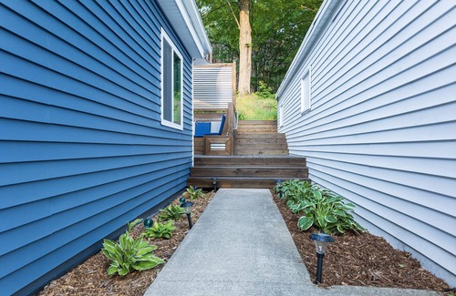 Alden House | Spacious home near Torch Lake w/custom back patio, steps away from public access