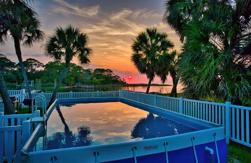 St. George Island House | Spacious house- Deep Water Dock, Pool, Game Room, Hot Tub, Fenced Yard & more!