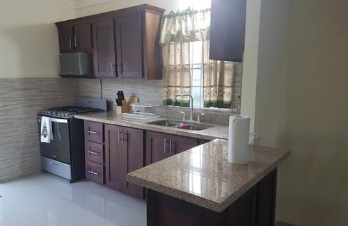 Falmouth House | Spacious two bedroom home with ocean view, pool and tennis court.