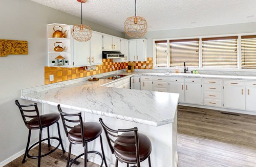 Kalispell House | Spacious lakefront home with private hot tub, kayaks, canoes & dock