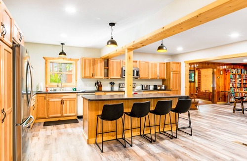 Presque Isle Cabin | Spacious lakefront lodge with fireplaces, WiFi, W/D, dock, & resort game room
