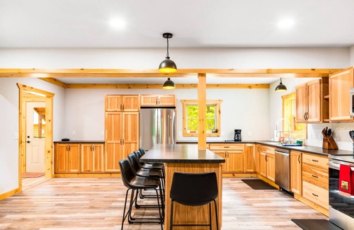 Presque Isle Cabin | Spacious lakefront lodge with fireplaces, WiFi, W/D, dock, & resort game room