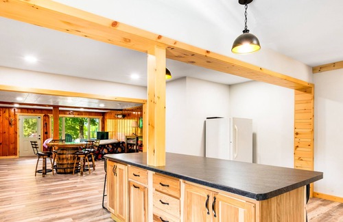 Presque Isle Cabin | Spacious lakefront lodge with fireplaces, WiFi, W/D, dock, & resort game room