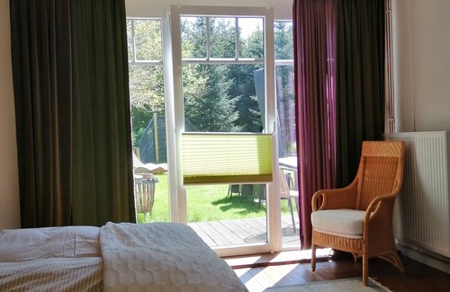 Varel Other | Spacious vacation apartment with fireplace and barrel sauna in the sheltered garden.
