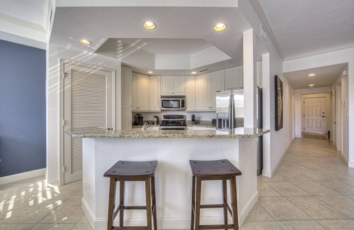 Bonita Shores Condo | Spiral staircase will take you to the resort pool.