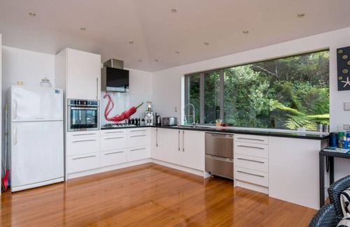 Mangawhai Heads House | Spits End - Large, modern holiday home with stunning views a short walk to estuary surf beach
