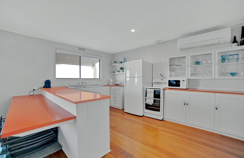 Bridport House | Spoil yourself in this centrally located beach house overlooking the vast.