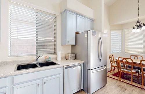 Carefree Crossing House | Sprawling home with an enclosed yard, open layout, fireplace, grill, & W/D