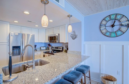 Sneads Ferry Condo | St. Regis beach condo with oceanfront views, pool, gym & restaurant