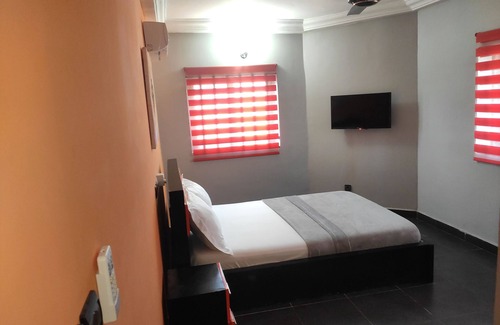 Lome House | Standard Double Bed in Royal Blue Guest House and Bar