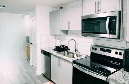 Northwest Calgary House | Starlight Haven: Modern 2-Bedroom Suite, Private Entry near Shopping & Dining