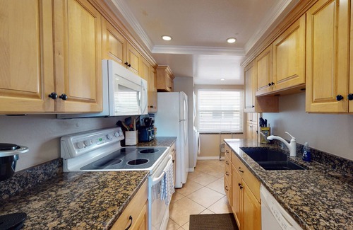 Madeira Beach Condo | Stay Across from Johns Pass Village. Heated Pool. Direct Beach Access. Secure Building.