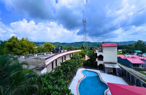 Ramnagar Hotel | Staybook The Rudveda Resort - Free High Tea near Pool Area