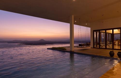 Igatpuri Villa | StayVista at Sunset on the Lake - Infinity Lakeview Swimming Pool with Contemporary Interiors & Lavish Amenities