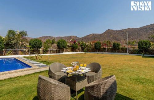 Bedla Villa | StayVista's Bella Dream - Mountain-View with Outdoor Pool, Lawn featuring a Gazebo & Indoor Games