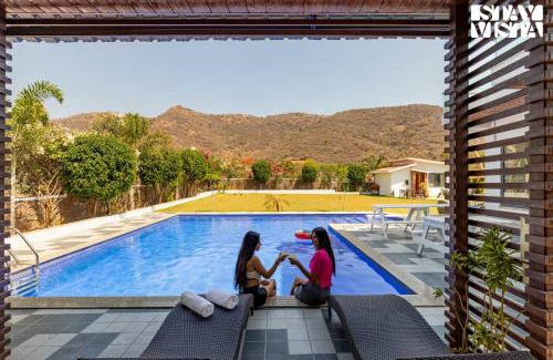 Bedla Villa | StayVista's Bella Dream - Mountain-View with Outdoor Pool, Lawn featuring a Gazebo & Indoor Games