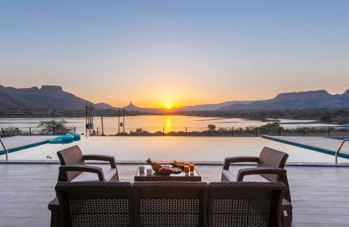 Nashik Villa | StayVista's Bellisimo Panorama - Lakeside Oasis with Infinity Pool, Modern Interiors, Open-to-Sky Bathtub, and Lush Green Lawn