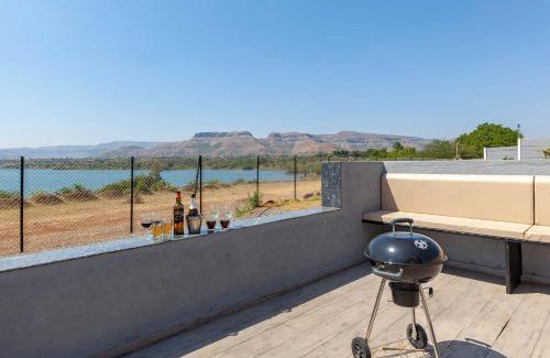 Nashik Villa | StayVista's Bellisimo Panorama - Lakeside Oasis with Infinity Pool, Modern Interiors, Open-to-Sky Bathtub, and Lush Green Lawn