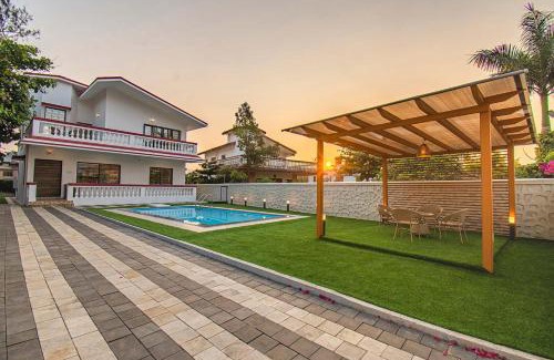 Kune N.m. Villa | StayVista's Brookvale Cottage - Dive into tranquility with pool view and gazebo