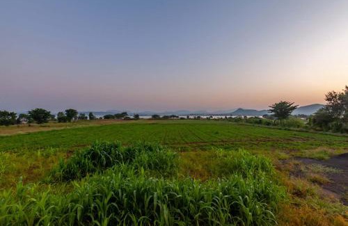 Nashik Villa | StayVista's Lake La Vie - Tranquil Lake-View Villa Amidst Farmland with Pool and Poolside Gazebo - Proximity to Sula