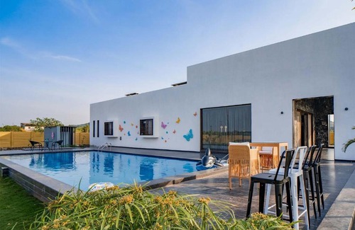 Nashik Villa | StayVista's Le Bon Horizon - Hillside Elegance with Chic Interiors, Poolside Serenity & Picturesque Gazebo - Proximity to Sula