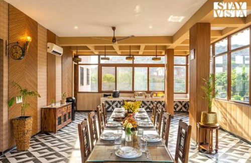 Gurugram Villa | StayVista's Shivoham Farms - Mountain-View Villa with Outdoor Pool, Lawn, and Terrace