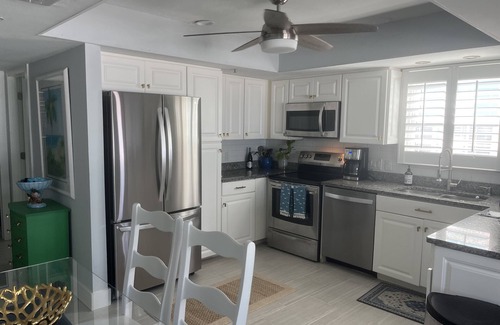Mid Island House | Steps away from the sugar white sands and blue water!