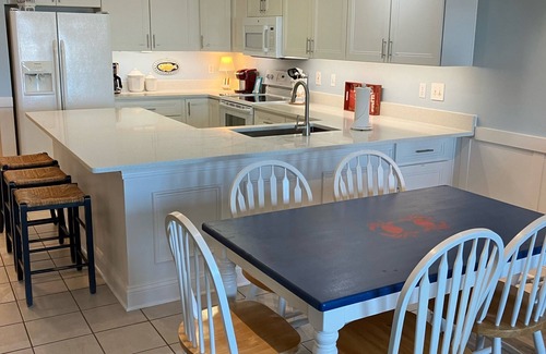 Tybee Island Condo | Steps to Beach! Gated garage. Park, 1 min.walk to restaurants and town. 5 Star!