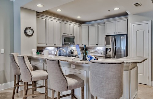 Crystal Beach Condo | Steps to the Gulf and private beach, heated pool, gym; walk to food and fun!