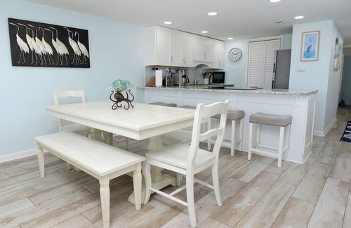 Sunnyside Condo | Steps to the beach with wrap-around ocean-front balcony